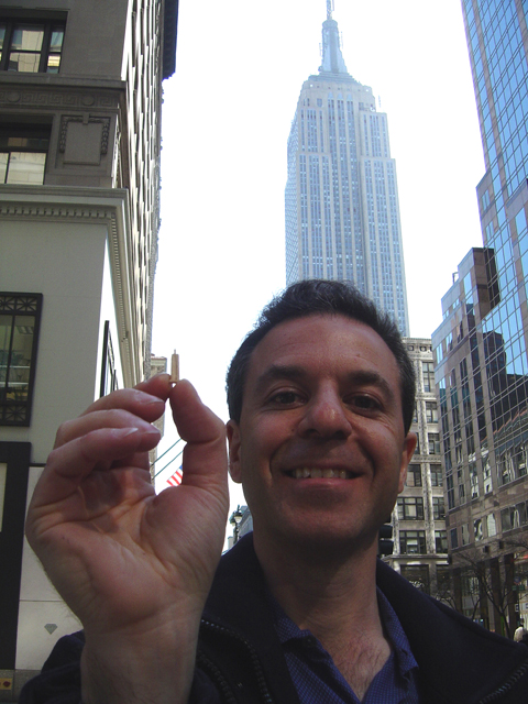 Steven J. Backman Holding Miniature Empire State Building
